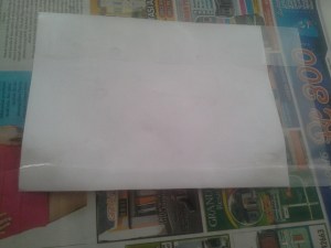 masukkan dalam plastik sampul buku, lipat sisanya ke dalam dan rapikan dengan esolasi bening